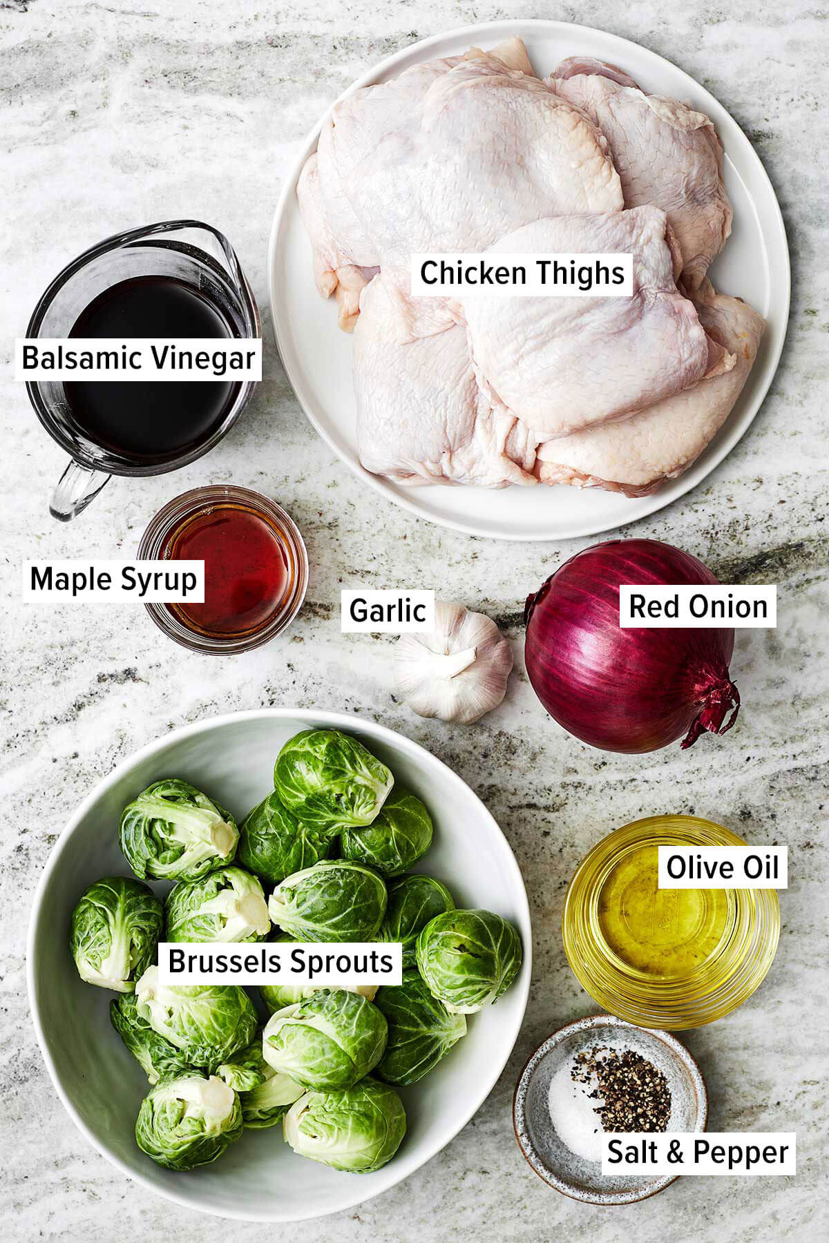 Ingredients for balsamic chicken and veggies on a table