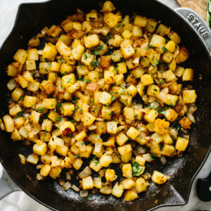 Crispy breakfast potatoes in a skillet.