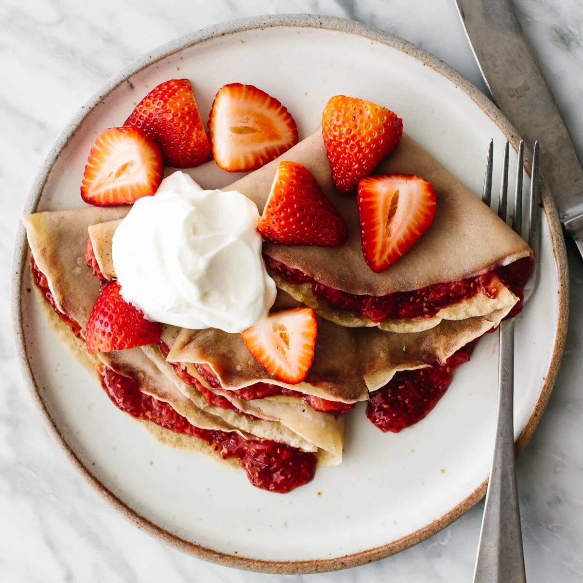 Strawberry crepes on a plate for a budget meal prep