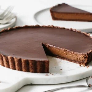 A slice cut from the chocolate tart recipe.