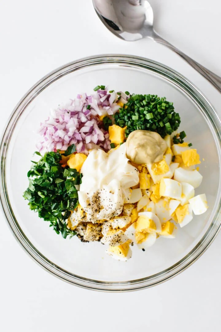 Egg salad ingredients in a bowl