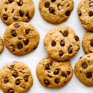 Gluten-free chocolate chip cookies scattered.