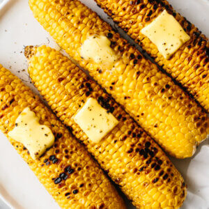 Grilled corn on the cobs with slabs of butter