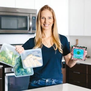Girl holding budget friendly healthy food.