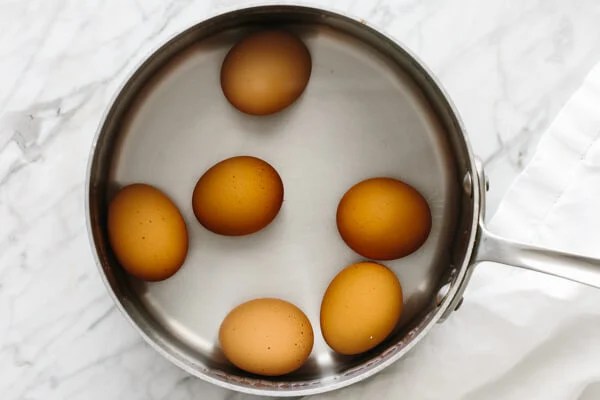 Boiling eggs in a pot.