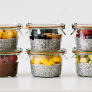 Chia pudding meal prepped with fresh fruit in glass containers.