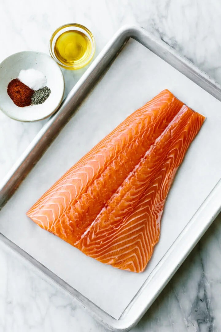 A raw salmon on a sheet pan for salmon salad