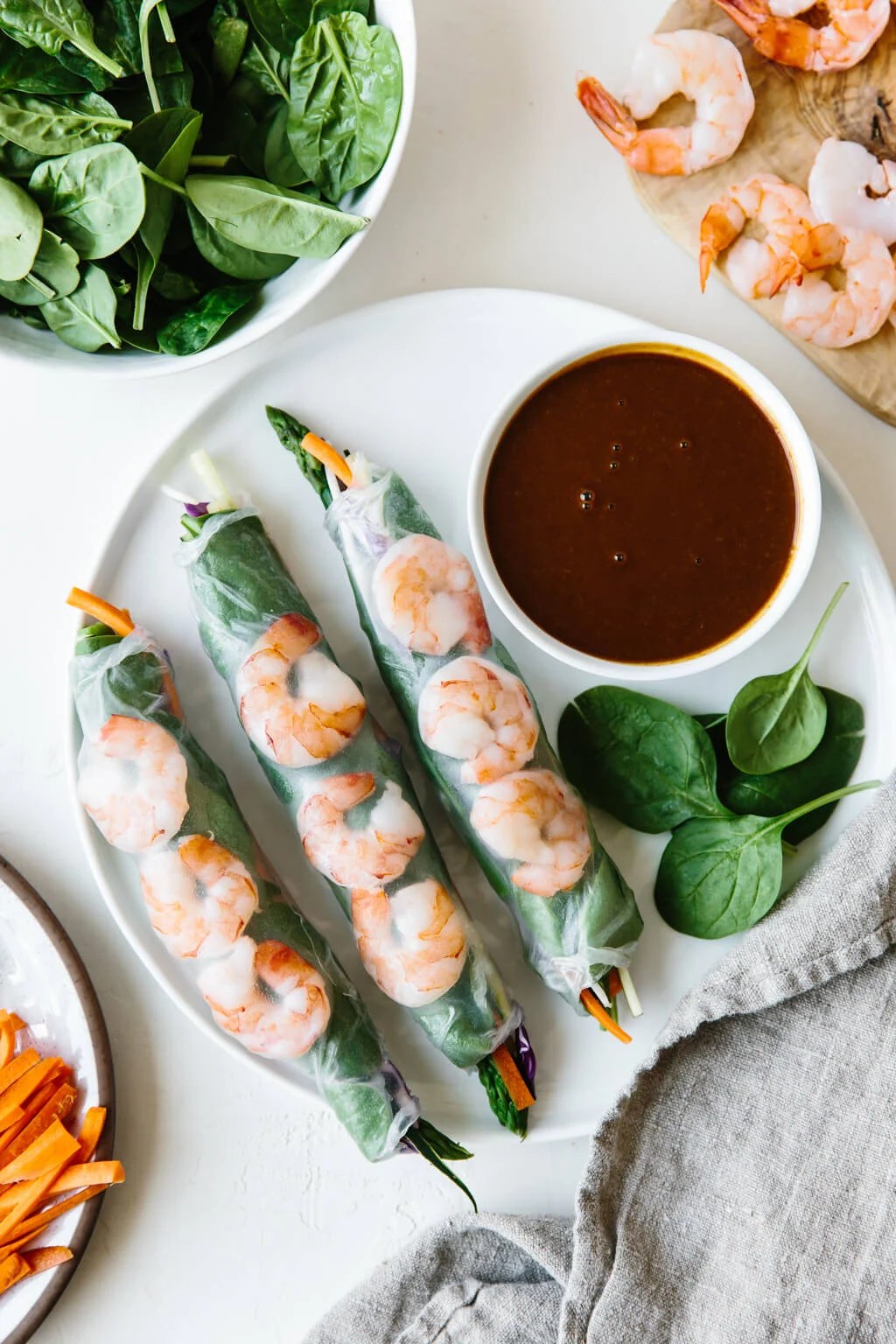 Vietnamese spring rolls filled with shrimp, spinach and vegetables and served with an almond butter dipping sauce. They're the perfect light and healthy recipe.